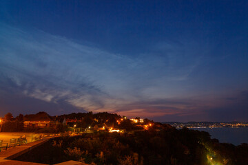 Obraz premium Noctilucent clouds over the skies of Balaton in Tihany near the church.