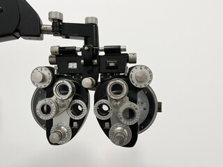 Black ophthalmological instrument for calibrating sight isolated on white background	

