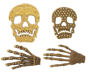Isolated png photo of bronze metal ornate skulls and hands pendants on transparent background.