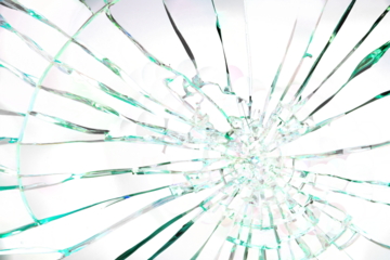 A shattered glass window with a green tint