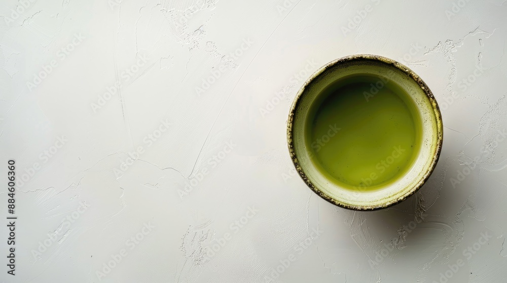 Poster matcha green tea cup seen from above on a white surface