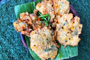 A plate of corn fritters. bakwan jagung