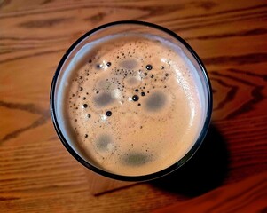 Glass of dark beer on the table. View from the top. High quality photo