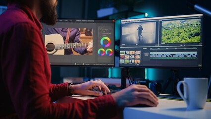 Video editor working for independent production company inputting music, dialogues, graphics and...