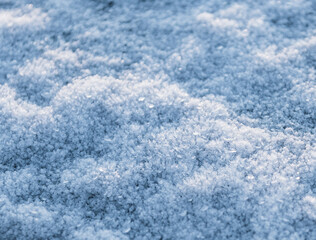 Ice crystals on stone in low sun light.
