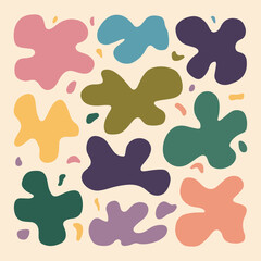 A collection of abstract shapes resembling organic forms. These shapes are in various colors, including pink, yellow, blue, green, and purple. They are spread out in a seemingly random pattern against