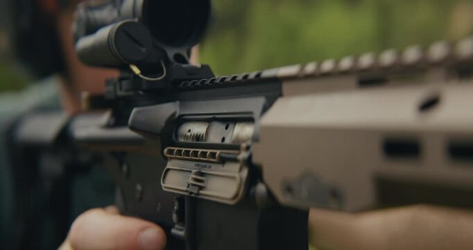 Young man shooting an AR-15