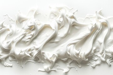 A close-up shot of white frosting on a smooth white surface