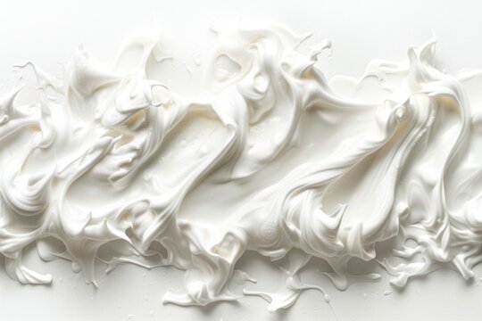 A close-up shot of white frosting on a smooth white surface