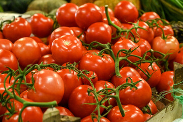 Fresh tomatoes on the market. Delicious red tomatoes for sale.