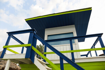 Empty wooden watch tower against blue sky on sunny day