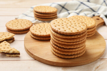 Fresh tasty sandwich cookies on wooden table, closeup