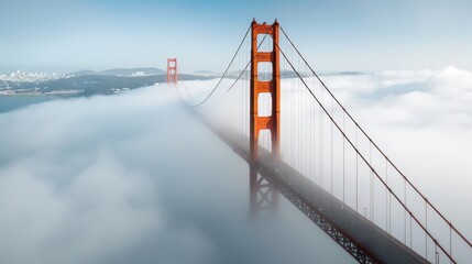 Obraz premium Golden Gate Bridge in the fog, San Francisco skyline in the background, iconic suspension bridge, atmospheric scenery, detailed structure