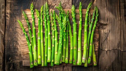 Asparagus displayed on a wooden surface