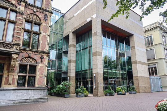 The Hague, Netherlands - August 20 2021 : the entrance doors of the modern dutch parliament build next to historic governmental buildings