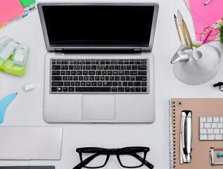 desk, a computer, keyboard, mouse, monitor, notebook, pen, pencil for down notes. organized with a stapler, paper clips, sticky notes, and a desk lamp, lit, include a coffee mug, pictures, plant
