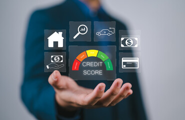 Credit score concept, businessman holding virtual screen of credit score icon for chart with credit history values. Online credit score ranking check. student loan, mortgage and payment cards.