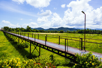 Boon Soong Iron Bridge with green glass field in Phang-nga Thailand