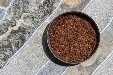 Tea leaf after blended and dried in the bowl. Tea Powder. Indonesian Tea