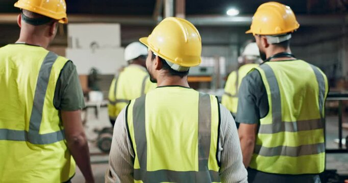 Walking, engineering and teamwork of people in warehouse with wood, lumber or material production. Back of group and supervisor in factory with safety gear for inspection, manufacturing and progress