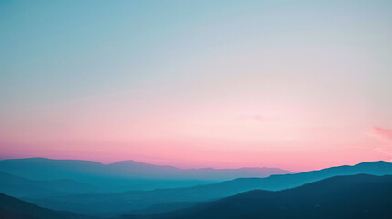 Fototapeta premium A photograph of a frosty mountain range at dawn, light pink and blue sky, sharp peaks, serene and majestic setting