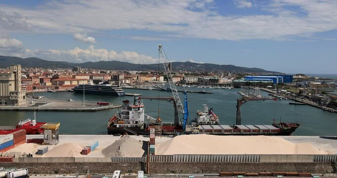 Livorno Italy port and harbor Mediterranean bulk ship ferry. Port city Ligurian Sea in Tuscany, Italy. Foreign traders shipping companies. Italian Mediterranean seaport. Import and export.