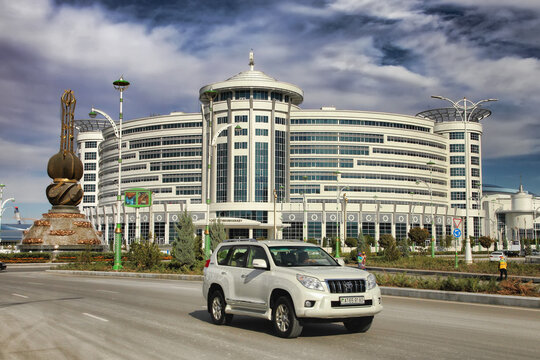 Ashgabat, Turkmenistan - October 20, 2023: View of the Sport Hotel and the art monument.
