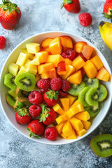 Overhead view of a bowl filled with fresh healthy fruit salad