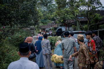 Engagement procession in the java village with happy people