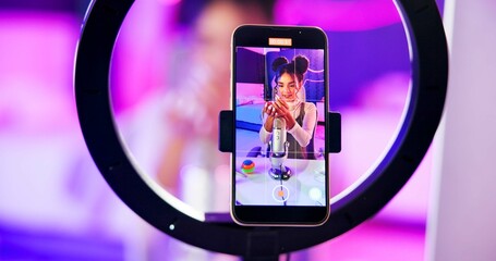Phone screen, girl and ring light for live streaming, sound recording and microphone for online followers subscription. Gen z influencer or content creator on mobile, product review or makeup at home