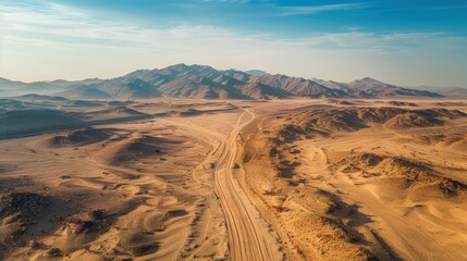 Aerial View of Vast Desert Landscape with Mountain Range and Clear Blue Sky
