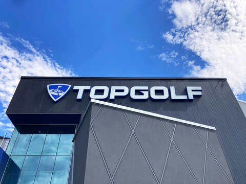 Topgolf sign, logo on the building facade of sport entertainment venue - San Jose, California, USA - June 25, 2024