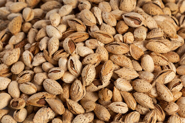 Tasty fresh almond nuts, background, texture. Selective focus. High quality photo