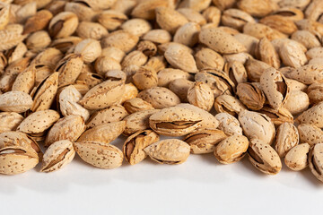 Tasty fresh almond nuts, background, texture. Selective focus. High quality photo