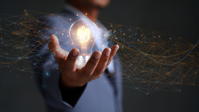Solution or creative idea for designing a web banner or landing page for an innovative company with a hand sticking out of the screen with a light bulb. Famous abstract geometric shapes and lead lines