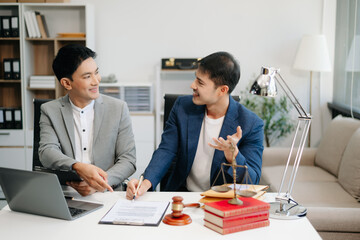 business people and lawyers discussing contract papers sitting at the table. Concepts of law, advice, legal services.