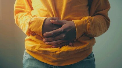 Person experiencing severe bloating and gas pain, shown holding their stomach and grimacing, with a focus on the physical discomfort caused by H.pylori.