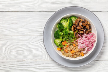 quinoa with veggies and mushrooms in a bowl