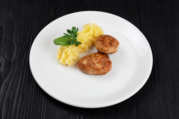 Chicken meat cutlet with mashed potatoes on white plate