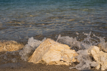 Wave Crashing on Rock Bright Blue Water