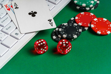 Playing Cards, Dice, and Chips on Green Felt Gaming Table With Keyboard