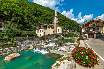 Small town and alpine river in Aosta Valle, Italy.