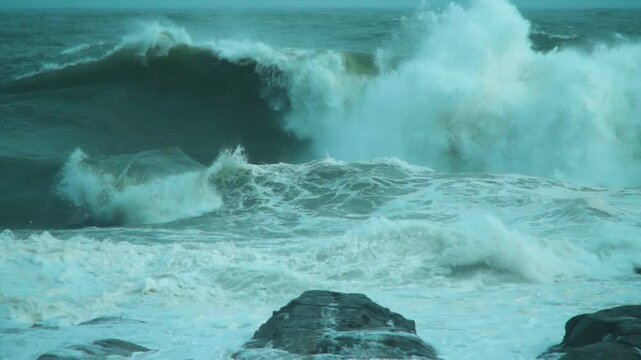 Storm swell waves crashing into the shore
