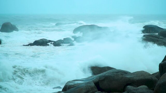 Storm swell waves crashing into the shore