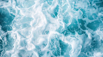 Obraz premium A close-up shot of turbulent ocean waves, with a detailed view of the frothy foam mixing with the crystal-clear blue water, creating a mesmerizing texture