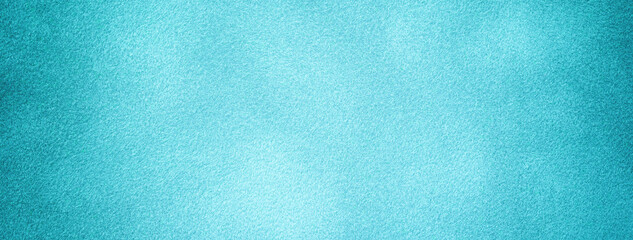 Light blue background of suede fabric with vignette, closeup. Velvet texture turquoise textile