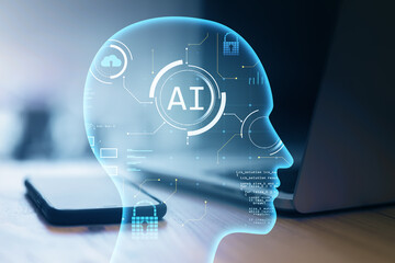 Close up of laptop and smartphone on desk with creative ai head outline on blurry background. Artificial intelligence and innovation concept. Double exposure.