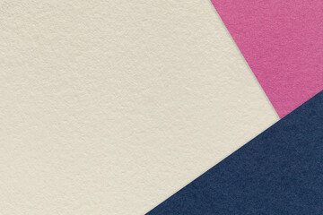 Texture craft light beige paper background with purple and navy blue border. Vintage abstract sand cardboard.