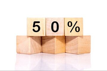 50 PERCENT TEXT ON WOODEN CUBES ON A WHITE BACKGROUND