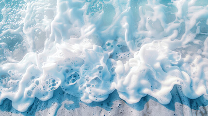 Obraz premium A detailed photograph of ocean waves with a close-up on the frothy foam and the clear blue water, capturing the energy and motion of the sea